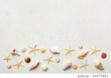 Summer time concept Flat lay composition with beautiful starfish and sea shells on colored table, top view with copy space for text 91975861