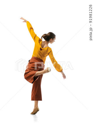 Studio shot of graceful young girl in action, motion isolated on white background. Contemp dance, start-up, open-space, professional occupation concept. Studio shot of graceful young girl in action, motion isolated on white background. Contemp dance, start-up, open-space, professional occupation concept. 91981226
