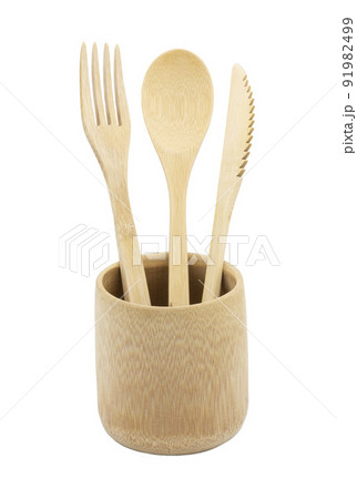 Bamboo wood cutlery, disposable fork, spoon,knife in bamboo cup made of natural material isolated on white background. Ecological concept. 91982499