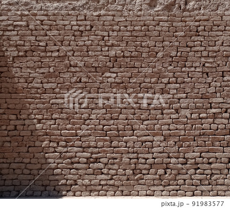Texture of an old wall made with stone bricks of sandstone in Egypt 91983577