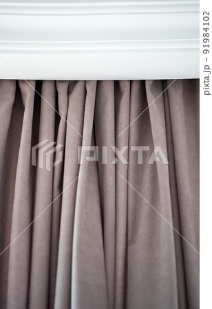 folds of curtains near the ceiling 91984102