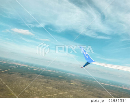 aircraft tail. travel through the sky to another country. the plane takes off into the sky. the plane flies through the sky in the clouds aircraft tail. travel through the sky to another country. the plane takes off into the sky. the plane flies through the sky in the clouds 91985554