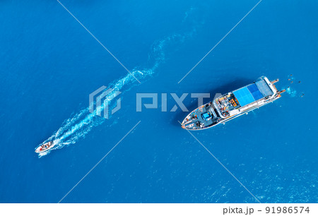 Aerial view of beautiful yacht and boat on the sea at sunset 91986574