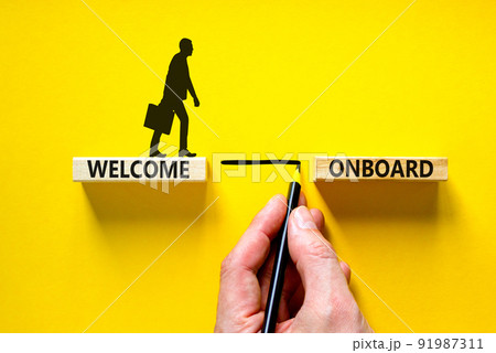 Welcome onboard symbol. Concept words Welcome onboard on wooden blocks on a beautiful yellow table yellow background. Businessman hand. Business onboarding and welcome onboard concept, copy space. Welcome onboard symbol. Concept words Welcome onboard on wooden blocks on a beautiful yellow table yellow background. Businessman hand. Business onboarding and welcome onboard concept, copy space. 91987311