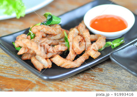 pork or fried pork , deep fried pork with sauce pork or fried pork , deep fried pork with sauce 91993416