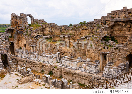 Ruins of ancient amphitheater (Theater) in Perge. Built in the Greco-Roman style, Perge is an ancient Greek city in Antalya 91996578