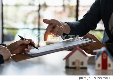 Real estate concept. Businessman pointing at agreement contract. 91997961