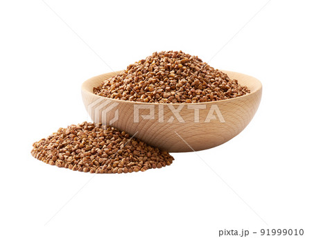 Organic buckwheat in a wooden bowl isolated on white background. 91999010