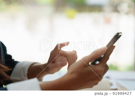 A businesswoman completes KYC using an online banking program in order to open a digital savings account. The definition of cyber security. 91999427