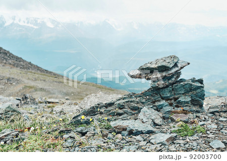 Dramatic panoramic landscape of rocky mountains among storm clouds Dramatic panoramic landscape of rocky mountains among storm clouds 92003700