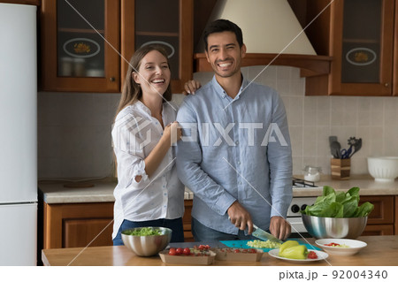 Married couple prepare natural healthy food together at home Married couple prepare natural healthy food together at home 92004340