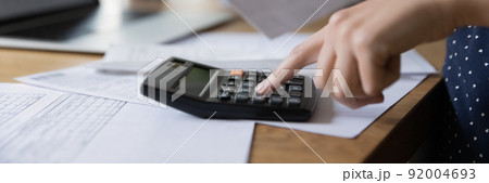 Accounting professional woman counting money, expenses, fees 92004693