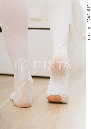 Anti-embolic Compression Hosiery for surgery isolated on white. Medical white stockings, tights for varicose veins and venouse therapy. Thrombo embolic deterrent hose or anti-embolism stockings. Anti-embolic Compression Hosiery for surgery isolated on white. Medical white stockings, tights for varicose veins and venouse therapy. Thrombo embolic deterrent hose or anti-embolism stockings. 92004812