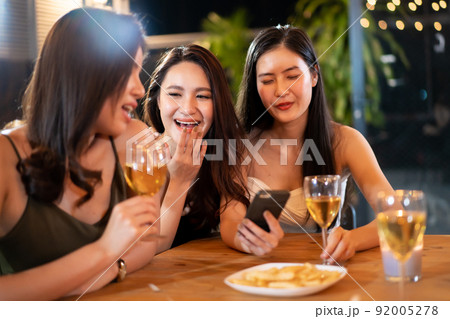 Happy Asian women enjoy celebrating a new year eve festival together with a lot of drink and food. New Year Eve party concept. 92005278