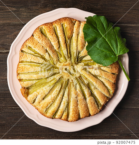 Rhubarb pie, top view on dark wooden background 92007475