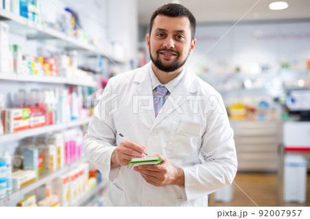 Portrait of male pharmacist working in drugstore Portrait of male pharmacist working in drugstore 92007957
