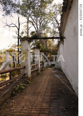 Evocative autumnal scene of a weathered old porch 92009739