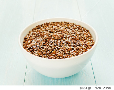 Flaxseed on wooden background Flaxseed on wooden background 92012496