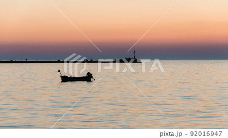 Silhoutte of a pier in Umag port Silhoutte of a pier in Umag port 92016947