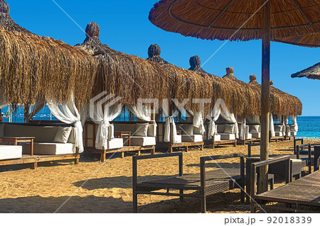 View of deck chairs and umbrellas on the sandy beach of Kemer, Turkey. View of deck chairs and umbrellas on the sandy beach of Kemer, Turkey. 92018339