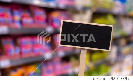 Blank Black billboard against shop Empty mockup template Blackboard label at shopping mall store. Shopping center. Department store. Shopping online Mindful spending 92018397