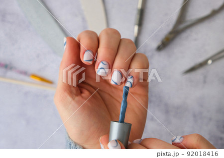 Professional stylish trendy blue Hardware Manicure. Procedure for the preparation of nails. Top view flat lay. Self care. Spa, beautician advertisement. Professional stylish trendy blue Hardware Manicure. Procedure for the preparation of nails. Top view flat lay. Self care. Spa, beautician advertisement. 92018416