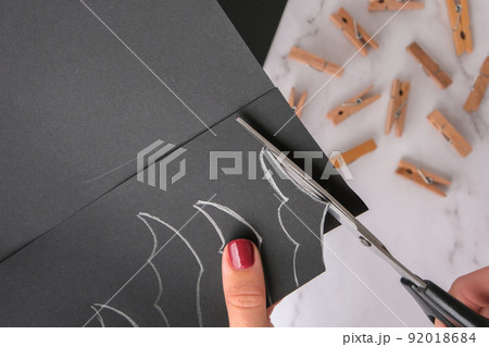 Paper bats. Halloween holiday decorations. Flat lay, top view Happy Halloween party concept. Children's art project. DIY concept. Step by step Paper bats. Halloween holiday decorations. Flat lay, top view Happy Halloween party concept. Children's art project. DIY concept. Step by step 92018684