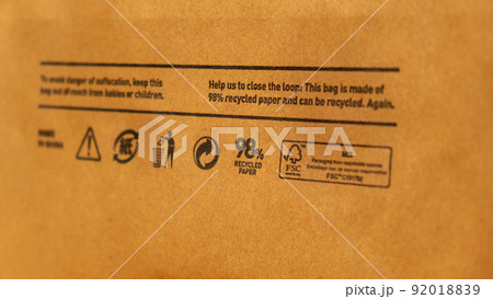 Recycling bag Closeup view of pap sign and other eco-label on Brown paper bag that is 100 recyclable and reusable spbd. Symbol indicates paper and cardboard. Concept 92018839