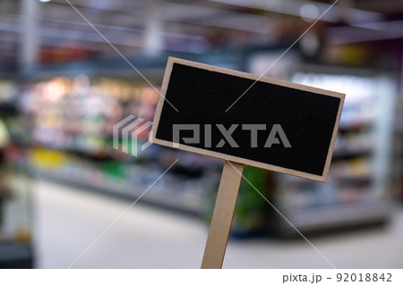 Blank Black billboard against shop Empty mockup template Blackboard label at shopping mall store. Shopping center. Department store. Shopping online Mindful spending 92018842
