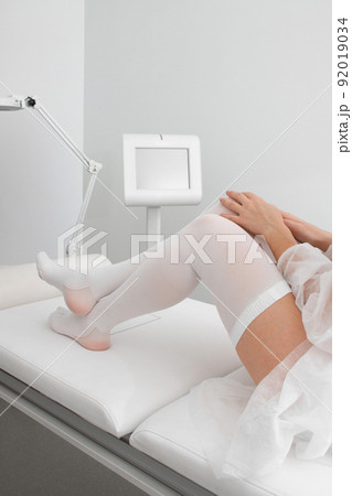 Anti-embolic Compression Hosiery for surgery isolated on white. Medical white stockings, tights for varicose veins and venouse therapy. Thrombo embolic deterrent hose or anti-embolism stockings. Anti-embolic Compression Hosiery for surgery isolated on white. Medical white stockings, tights for varicose veins and venouse therapy. Thrombo embolic deterrent hose or anti-embolism stockings. 92019034