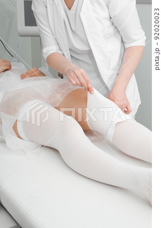 Anti-embolic Compression Hosiery for surgery isolated on white. Medical white stockings, tights for varicose veins and venouse therapy. Thrombo embolic deterrent hose or anti-embolism stockings. 92020023