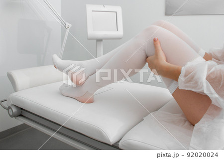 Anti-embolic Compression Hosiery for surgery isolated on white. Medical white stockings, tights for varicose veins and venouse therapy. Thrombo embolic deterrent hose or anti-embolism stockings. Anti-embolic Compression Hosiery for surgery isolated on white. Medical white stockings, tights for varicose veins and venouse therapy. Thrombo embolic deterrent hose or anti-embolism stockings. 92020024