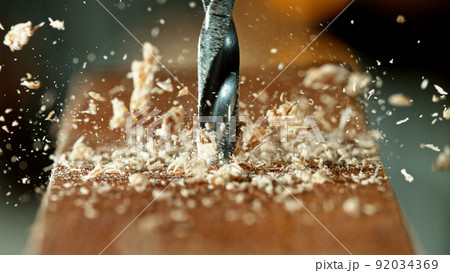 Drilling wooden plank, close-up. Drilling wooden plank, close-up. 92034369