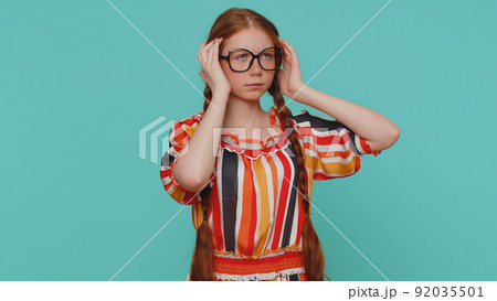 Ginger girl rubbing temples to cure headache problem, suffering from tension and migaine stress pain 92035501