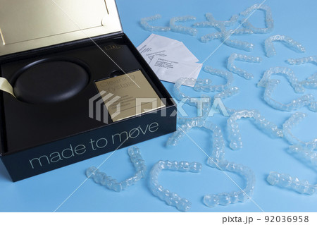 Invisalign transparent braces or brackets package box on blue background 92036958