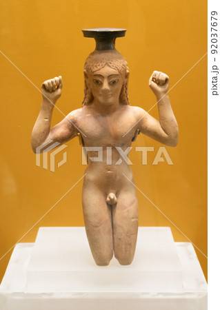 Perfume bottle in the form of a kneeling athlete binding a ribbon around head as a symbol of victory Perfume bottle in the form of a kneeling athlete binding a ribbon around head as a symbol of victory 92037679
