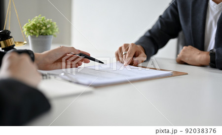 A professional female lawyer is having a formal meeting in the office A professional female lawyer is having a formal meeting in the office 92038376