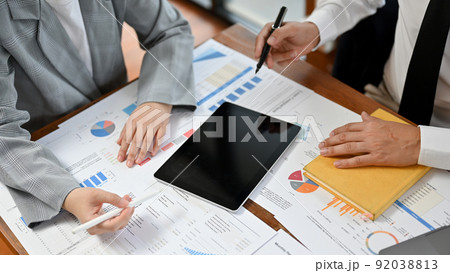 Top shot, Business people having a financial meeting together Top shot, Business people having a financial meeting together 92038813