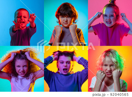 Children's emotions. Set of portraits of little cute kids, boys and girls isolated on multicolored background in neon light. Education, wow emotions, facial expression Children's emotions. Set of portraits of little cute kids, boys and girls isolated on multicolored background in neon light. Education, wow emotions, facial expression 92040565