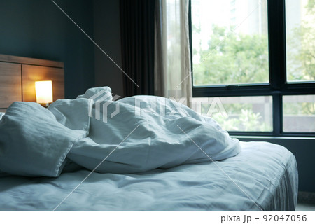 messy bed in early morning , messy bed after waking up messy bed in early morning , messy bed after waking up 92047056
