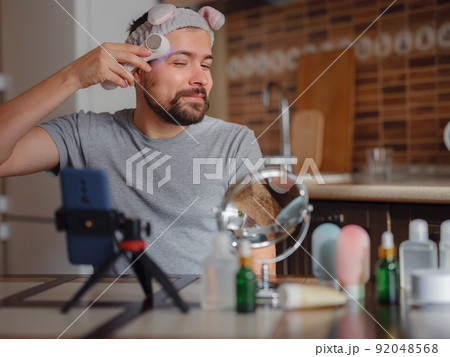 Men's beauty concept. caucAsian guy checking his skin. 92048568