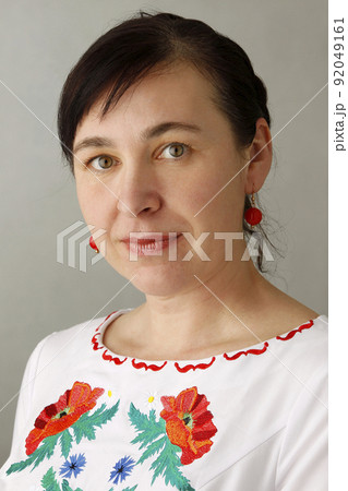 Portrait of a beautiful woman with embroidered shirt 92049161