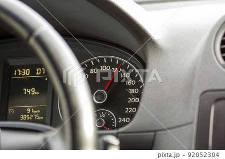 Close up interior view of modern luxurious black car. Dashboard, steering wheel, speedometer. Speed, comfort and luxury. Close up interior view of modern luxurious black car. Dashboard, steering wheel, speedometer. Speed, comfort and luxury. 92052304