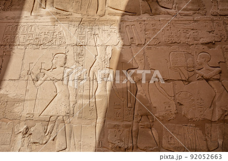 Different hieroglyphs on the walls and columns in the Karnak temple. Karnak temple is the largest complex in ancient Egypt. Different hieroglyphs on the walls and columns in the Karnak temple. Karnak temple is the largest complex in ancient Egypt. 92052663