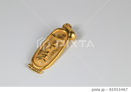 antique Hieroglyphic gold cameo, Golden material isolated on white background. antique Hieroglyphic gold cameo, Golden material isolated on white background. 92053467