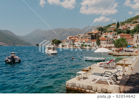Luxury boat yacht in Adriatic sea in Montenegro with scenic mountains view. Amazing landscapes of balkans and sailing transport 92054642