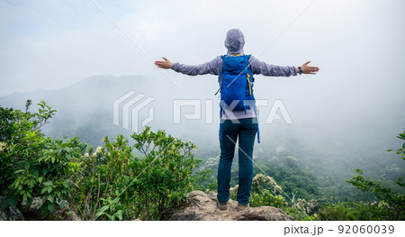 Successful hiker feel free on spring mountain top 92060039