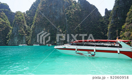 The boat sails near the island. The boat sails near the island. 92060958