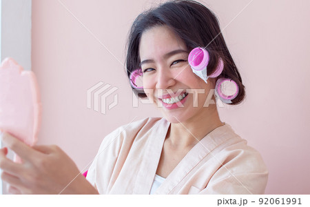 Portrait of asian beautiful woman wearing bath cover and rolling her hair 92061991