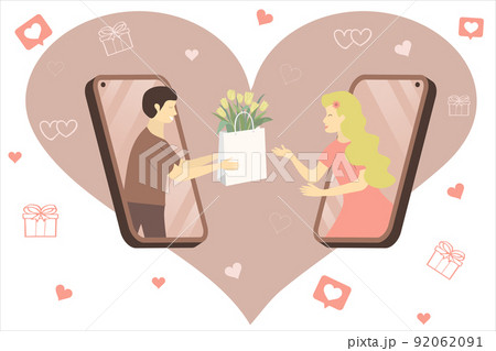 Lovers from the phone.  A guy in love from the phone gives a beautiful girl a package of tulips. Apps for online dating. 92062091